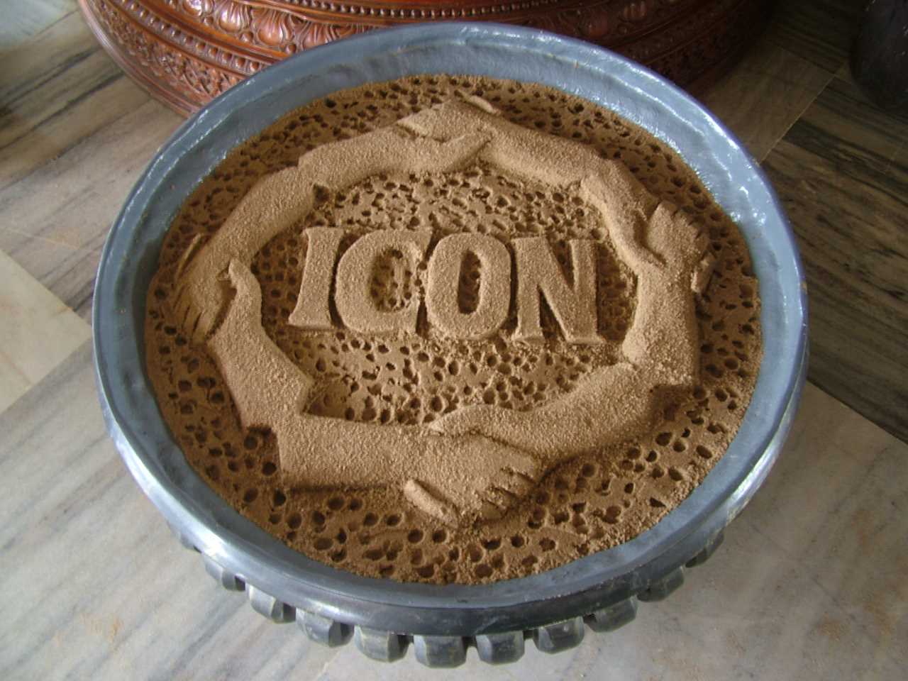 ICON logo in sand